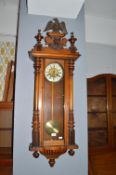 Vienna Wall Clock with Mahogany Case, Enamel & Brass Face, and Turned & Carved Detail Including