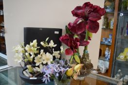 Artificial Flowers and a Large Black Pottery Vase
