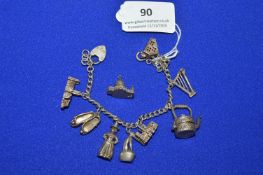 Sterling and Continental Silver Charm Bracelet with Assorted Charms