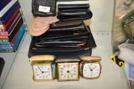 Leather Purses and Travel Alarm Clocks