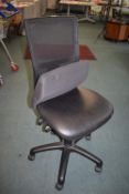 *Black mesh-back office swivel chair