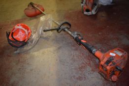 *Echo SRM-330 Petrol Strimmer, and a Makita Helmet & mesh Guard