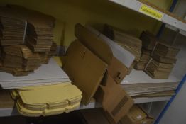 Shelf of Assorted Cardboard Boxes