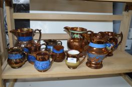 Large and Small Copper Lustre Jugs
