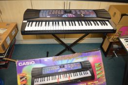 Casio CTK-560L Key Lighting System Electronic Keyboard with Stand and Packaging
