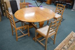 Oval Drop Leaf Dining Table and Four Ladderback Chairs