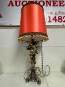 vintage gilt figural base table lamp with a red lampshade