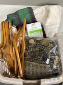 Baskets of blankets, linens and hangers