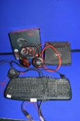 Evo ZXR Sound Blaster Gaming Headphones, and a Microsoft Keyboard