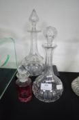 2x Cut Glass Decanters and a Cranberry Stoppered Bottle