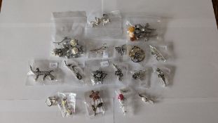 (22) Silver brooches