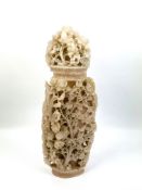 A large 19th century Chinese soapstone vase and cover