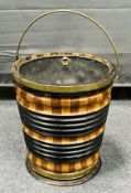 An early 19th century brass bound Dutch mahogany and fruitwood tapered cylindrical bucket