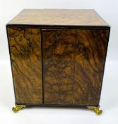 Two door burr walnut two over two cigar cabinet to brass feet
