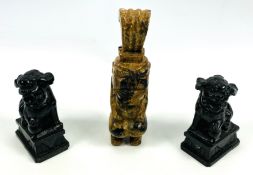 A pair of Chinese hardstone carvings of foo dogs together with an ethnic hardstone carving