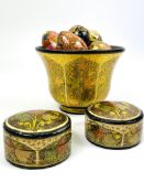 A collection of Kashmir lacquer wares to include a pair of circular lidded boxes