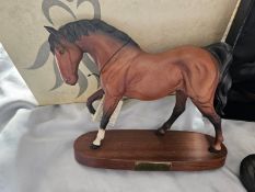 Three Beswick horses, one Royal Doulton horse, boxed