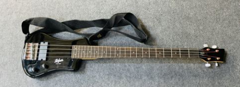 A Hofner Shorty bass guitar with soft case