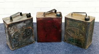 A collection of three early 20th century petrol cans