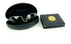 A pair of cased Armani Exchange sunglasses, together with a Gianni Versace leather wallet