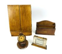 Four early 20th century desk top items to include a teak letter rack