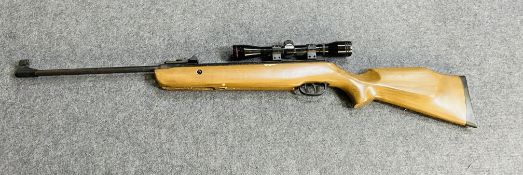An SMK 19.55 air rifle with telescopic sight