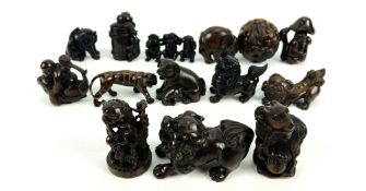 A collection of well carved hardwood Japanese netsuke