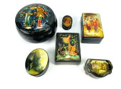 A collection of six various shaped Russian lacquered boxes, mainly depicting fairytale scenes
