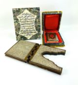Three items to include an embossed white metal mounted Quran stand
