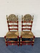 A pair of large carved red lacquered Andalusian high back side chairs