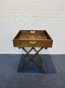 A 19th century oak butlers tray with an X frame turned stand