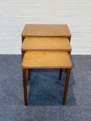 A mid century Danish style set of teak fitted nesting tables