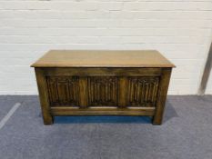 An 'Ipswich oak' style carved oak coffer