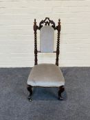 A small Victorian walnut upholstered chair
