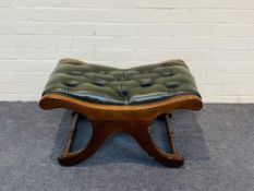 A mahogany stool with buttoned green leather upholstery and studded decoration