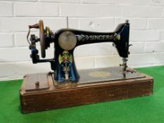 A decorative cased Singer sewing machine