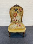 A mid 19th century carved walnut framed spoon back chair