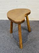 A good 'Mouseman' solid oak three-legged milking stool