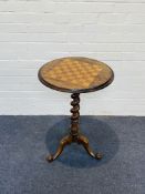 A Victorian circular rosewood chess top table
