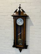 A walnut and ebonised cased Vienna clock