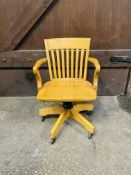 A good quality contemporary solid beech revolving desk chair