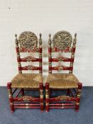 A pair of large carved red lacquered Andalusian high back side chairs
