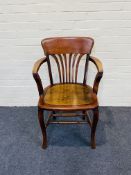 An early 20th century stained beech desk chair