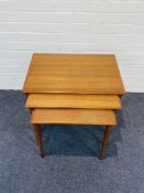 A mid century Norwegian set of teak nesting tables