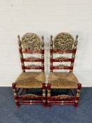 A pair of large carved red lacquered Andalusian high back side chairs