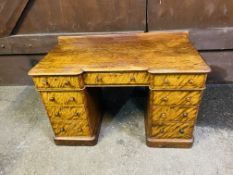 A Victorian satin birch inverted breakfront nine drawer pedestal dressing table