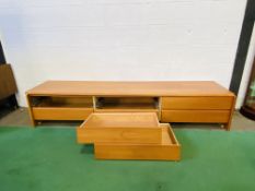 A mid century teak low level chest of drawers