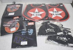 7 x Assorted Baby Items Including Trex Bonnet Hats, Kiss Baby Suits and The Clash Bibs -