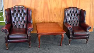 2 x Chesterfield Wingback Armchairs Upholstered in Oxblood Red Leather - Includes a Mahogony Coffee