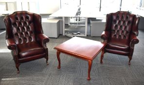 2 x Chesterfield Wingback Armchairs Upholstered in Oxblood Red Leather - Includes a Mahogony Coffee